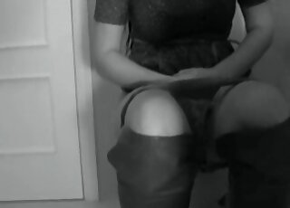 Black and white video of a woman in the toilet
