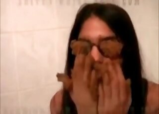 Covering her sunglasses with poop in the tub