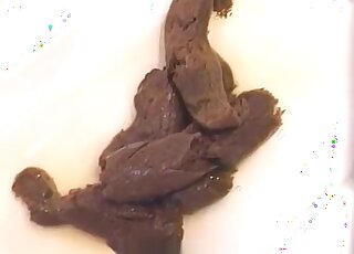 Leggy girl removes her pantyhose and shits on the floor