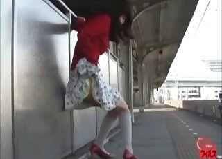 Girl in a cute skirt pooping while outdoors